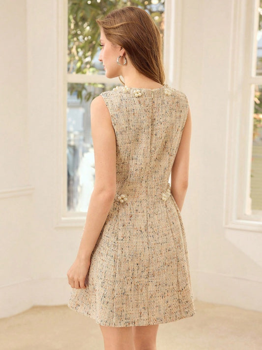 Speckled dress with ornate waistband