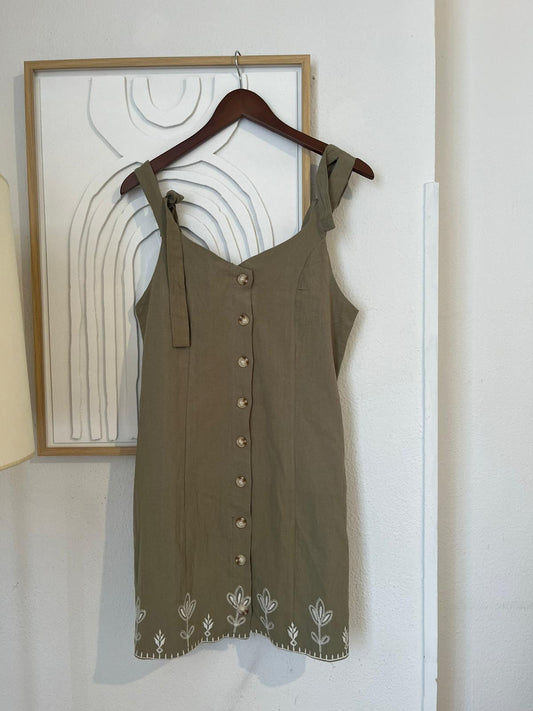 Olive green button-down dress with embroidered details at the hem
