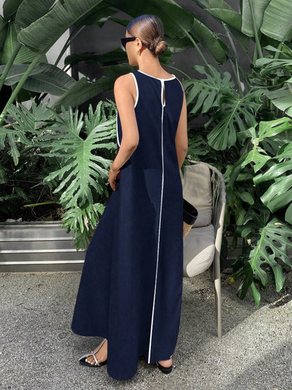 Long tent-cut dress with jewel neckline and white embroidery