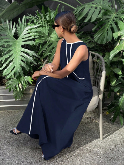 Long tent-cut dress with jewel neckline and white embroidery