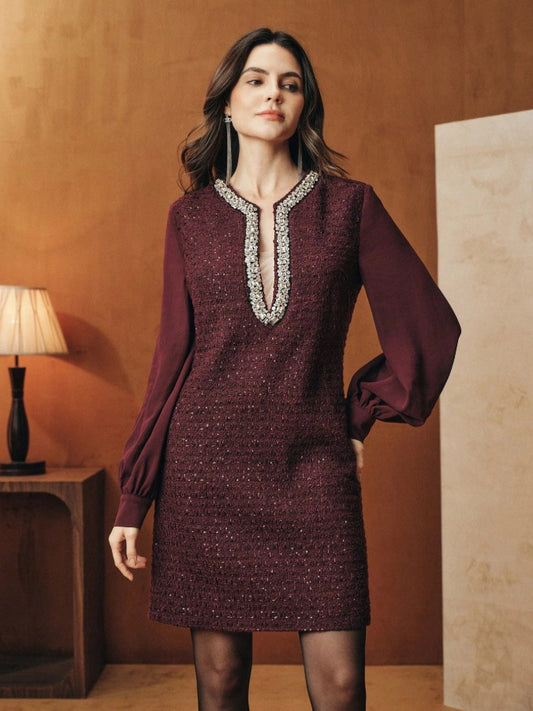 Tunic-style dress with buttoned sleeves and a sparkly neckline