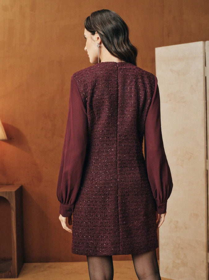 Tunic-style dress with buttoned sleeves and a sparkly neckline