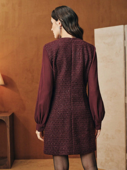 Tunic-style dress with buttoned sleeves and a sparkly neckline