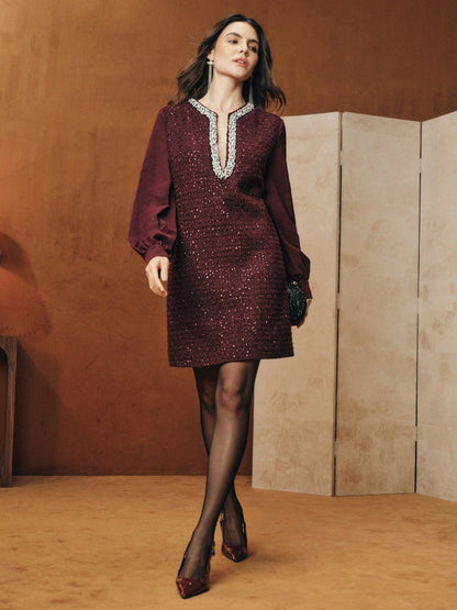 Tunic-style dress with buttoned sleeves and a sparkly neckline